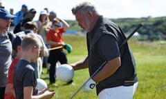 Darren Clarke signs autographs during a practice round prior to the Open Championship at Royal Portrush.