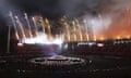 Athletes watch fireworks light up Carrara Stadium during the closing ceremony of the Commonwealth Games.