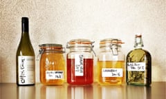 Jars of infusions on Mark Diancono's shelf.