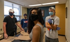 Ruchita Coomar and others prepare to protest I.C.E. in Monroe, Michigan.