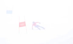 A view of a men’s giant slalom racer in poor visibility in the Beijing 2022 Winter Olympics on 13 February.