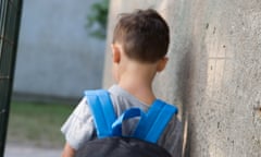 A boy in a schoolyard