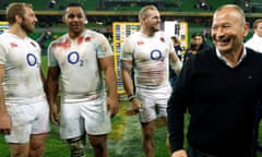 England's head coach, Eddie Jones, celebrates with his players after the win over Australia