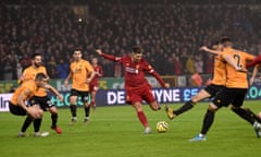 Liverpool’s Roberto Firmino scores against Wolves.