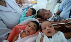 Nurses tend to newborn babies at the maternity ward of a hospital in Guwahati, in the Indian state of Assam