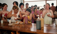 People queue for tea and hot dogs. From The Last Resort 1983-85