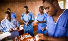 Healthcare workers prepare medicines at an Ebola treatment centre in Freetown, Sierra Leone