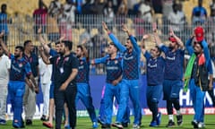 Afghanistan's players greet their fans at the end of their win over Pakistan