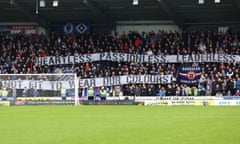 St Mirren v Rangers - cinch Premiership - The SMISA Stadium<br>Rangers fan holds up a large banner saying 'Heartless. Passionless. Leaderless. Not Fit To Wear Our Colours' during the cinch Premiership match at the SMISA Stadium, Paisley. Picture date: Sunday October 8, 2023. PA Photo. See PA story SOCCER St Mirren. Photo credit should read: Robert Perry/PA Wire. RESTRICTIONS: Use subject to restrictions. Editorial use only, no commercial use without prior consent from rights holder.