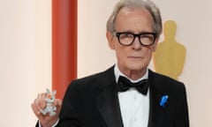 Bill Nighy with the stained Babblebrook family Sylvanian rabbit belonging to one of his granddaughters at the Oscars ceremony.