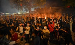 People burn incense and pray for good luck at a temple in Nanning, in China’s southern Guangxi region