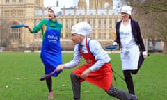 Baroness Bertin, Alastair Stewart OBE and Tracey Crouch MP pictured practicing for the Rehab Parliamentary Pancake Race.