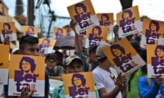 HONDURAS-ENVIRONMENT-INDIGENOUS-CACERES-MURDER-REPORT<br>Members of the Council of Popular and Indigenous Organizations of Honduras (COPINH) hold posters with an image of slain indigenous leader and environmental activist Berta Caceres, as they demand a 526-year sentence for Roberto Castillo, executive president of Desarrollos Energeticos (DESA), as a preliminary hearing in the case against him resumes, in Tegucigalpa on October 10, 2019. - A report from several international organizations implicated Roberto Castillo in the murder of Caceres, a case for which he has been imprisoned since 2018 when he was accused of being the mastermind of the crime. (Photo by Orlando SIERRA / AFP) (Photo by ORLANDO SIERRA/AFP via Getty Images)