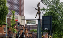 A street and a high rise and a Welcome to Ladywood sign