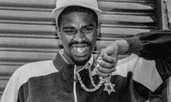 Slick Rick with his Star of David pendant and diamond-encrusted front tooth gold cap.