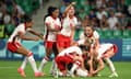  Vanessa Gilles of Canada celebrates with teammates after scoring her team's second goal. 