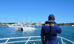 A crew member of the Police boat Veiqaravi keeping watch as they begin their entry procedures into Port Denarau