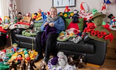 Rachel Williamson with crocheted postbox toppers at home in Rhyl, Wales