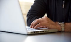 Male hands on laptop keyboard