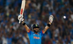 India’s Virat Kohli celebrates reaching his century and winning the match