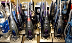 A line up of vacuum cleaners at a store