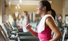 Woman exercising on treadmill in gym