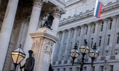 The Russian flag hangs from the Russian investment bank VTB Capital, above the war memorial to British soldiers killed in world war one.