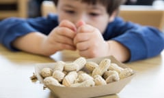 Little boy eating peanuts