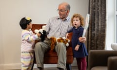 Belong resident Bill Jones with toddlers Serah Savio and Ashleigh Evans.