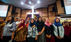 Indonesians from different religious groups take part in a joint prayer for the victims of a bomb attack on a church in Surabaya