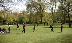 Children playing cricket in St James's Park, London