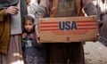 Afghans with aid donated by the World Food Programme. Billions of dollars of aid were spent in Afghanistan in the years before the Taliban return to power in 2021.