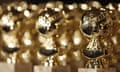 FILE - In this Jan.. 6, 2009, file photo, Golden Globe statuettes are displayed during a news conference in Beverly Hills, Calif. Nominations for the 75th annual Golden Globes will be announced on Monday, Dec. 11, 2017. (AP Photo/Matt Sayles, File)
