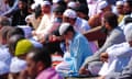 People during morning prayer in Southall Park, Uxbridge, west London