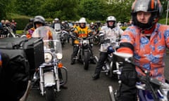 Motorcyclists, many in Hawaiian shirts, fill the road