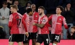 Southampton players celebrate a goal in their 5-0 rout of Swansea City at St Mary’s
