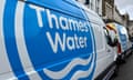 Thames Water vans are parked on a road as repair and maintenance work takes place, in London.