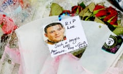 Floral tributes and a photograph of Lee Rigby with a message reading 'RIP Lee. Such a tragic loss'