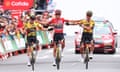 Sepp Kuss is flanked by Jonas Vingegaard (left) and Primoz Roglic as they cross the line to finish stage 20.