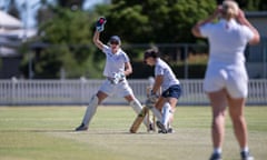 A wicketkeeper appeals as a batter grounds her bat