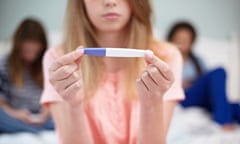 Teenage girl with pregnancy test