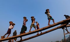 child labourers labourers loading and unloading a boat in Yangon.