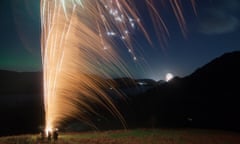 2016 ushered in by the Aurora Borealis and fireworks<br>Aurora Borealis and fireworks above a flooded Ullswater on New Years Eve.