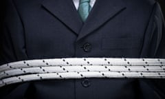Closeup on the chest of a tied up businessman
