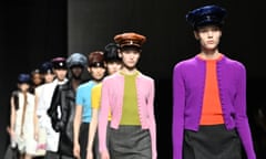 Models don peaked military-style caps in luxurious fabric on the runway at Milan Fashion Week Fall/Winter 2024/25