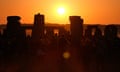 Beautiful sunrise, stones, and silhouettes of people