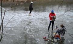 US-weather<br>People skate on a canal as a winter storm approaches Washington, DC, on January 16, 2022. - Millions of Americans were braced for heavy snow and freezing rain Sunday as a major winter storm closed in on the eastern United States, knocking power out to an estimated 200,000 people and counting. The "strong storm over the Southeast/Southern Appalachians will move northeastward inland from the coast to Southeastern Canada by Tuesday," the National Weather Service said on its website. (Photo by Daniel SLIM / AFP) (Photo by DANIEL SLIM/AFP via Getty Images)