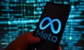 Meta logo is displayed on a smartphone