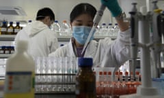 A sinovac researcher working on a covid-19 vaccine. some 90% of the firm’s employees and their families have been injected with the experimental jab