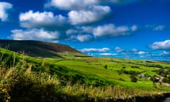 Pendle Hill On Sunny Day<br>Scenic view on Pendle Hill on summer. 16:9 aspect ratio, blue sky and white clouds. Forest Of Bowland , Lancashire, England UK